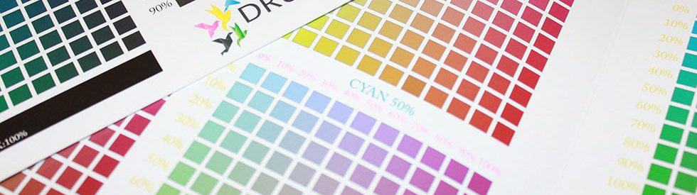 Photo of cmyk ink charts shows our background in sleuthing color issues and challenges.